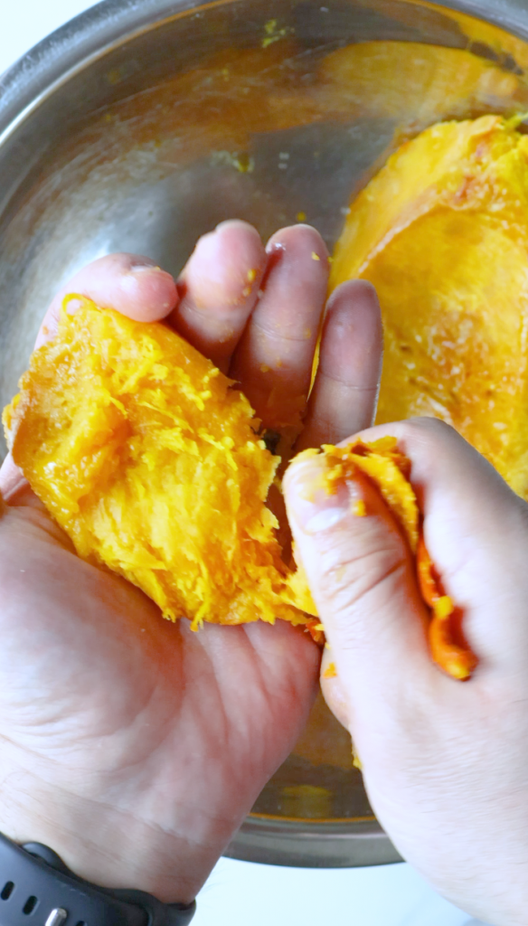 Remove the skin from your baked pumpkin, then mash pumpkin with chopped cilantro, black pepper, red chili flakes, coriander, garlic powder and salt.